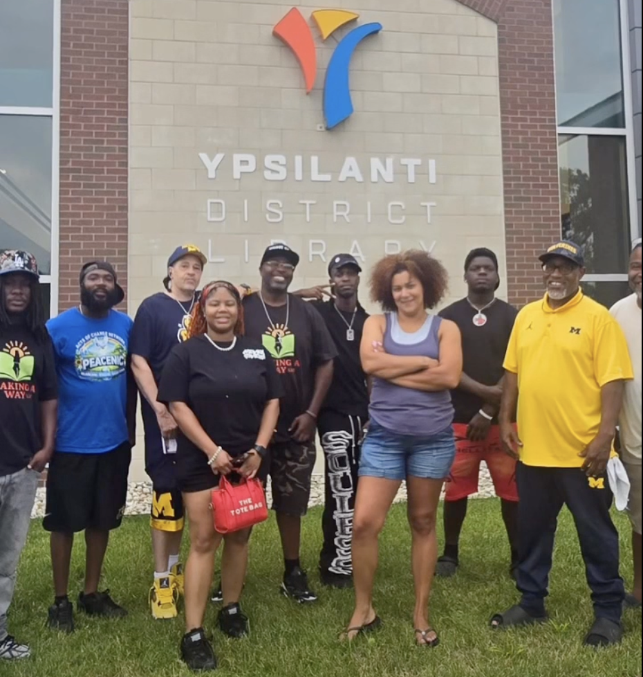 Community partners gathered outside the Ypsilanti District Library